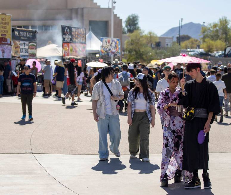 Festivalgoers walk by different vendors during the Aki Matsuri Japanese Festival at Water Stree ...