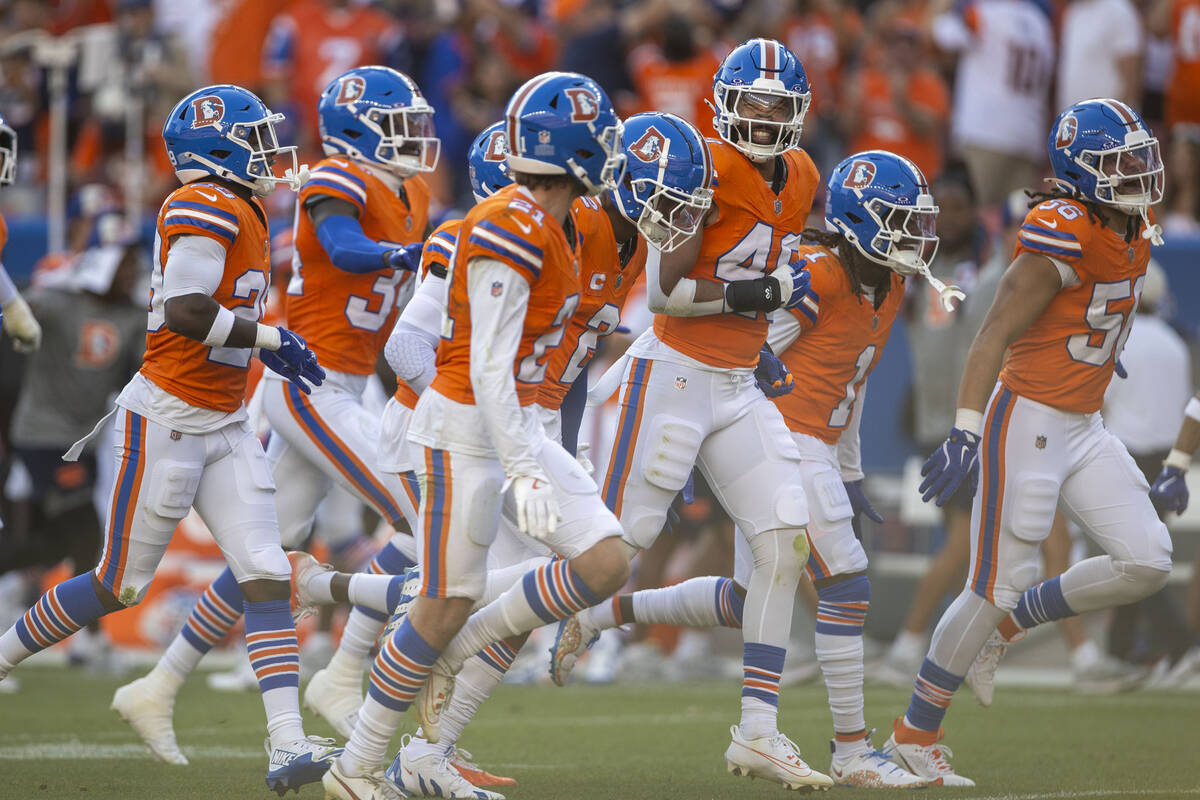 Denver Broncos cornerback Pat Surtain II (2) celebrates his interception of Raiders quarterback ...