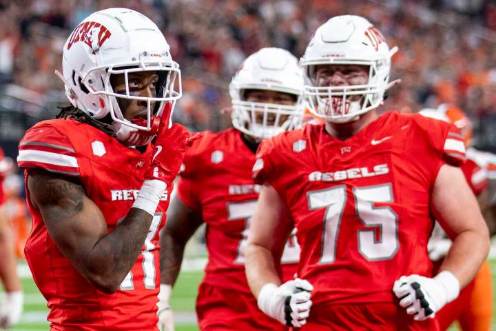 UNLV wide receiver Ricky White III (11) celebrates after scoring a touchdown during the college ...