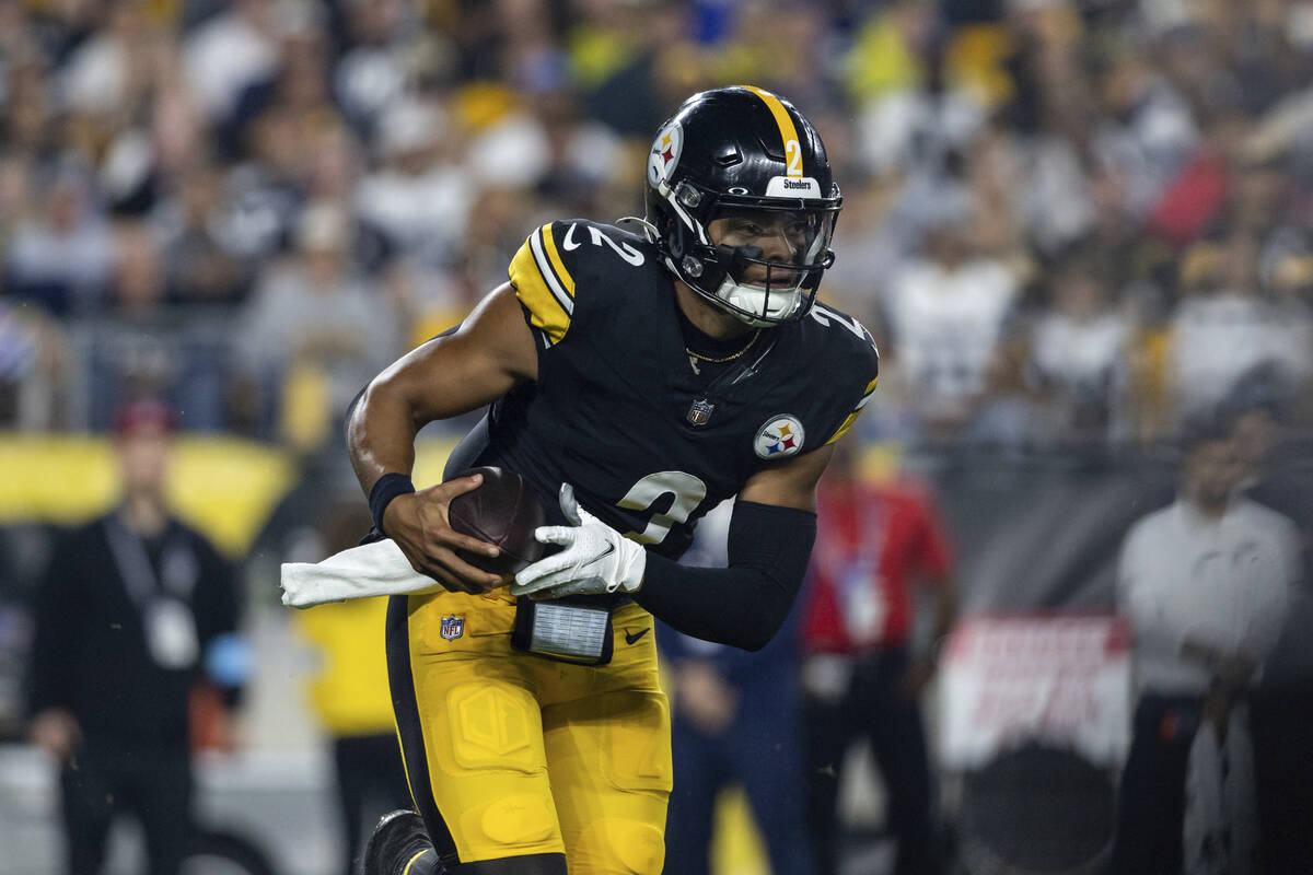 Pittsburgh Steelers quarterback Justin Fields (2) rolls out of the pocket during an NFL footbal ...