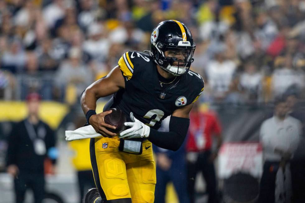 Pittsburgh Steelers quarterback Justin Fields (2) rolls out of the pocket during an NFL footbal ...