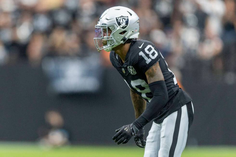 Raiders cornerback Jack Jones (18) sets up in coverage during the first half of an NFL game aga ...