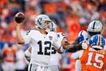 Raiders quarterback Aidan O'Connell (12) makes a throw against the Denver Broncos during the se ...