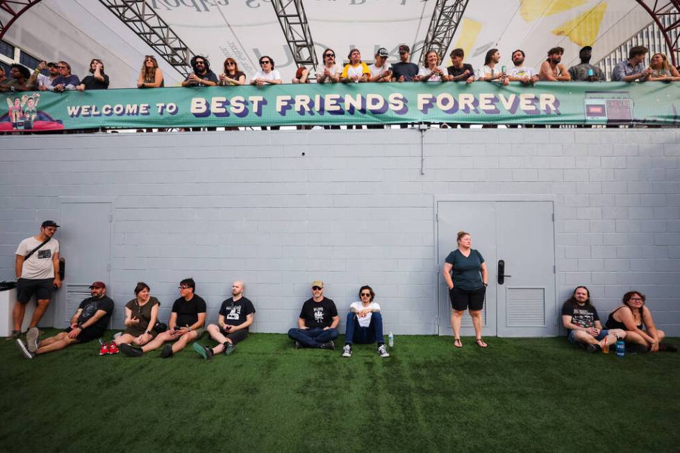 Festival attendees take in some music during the Best Friends Forever Festival at the Downtown ...