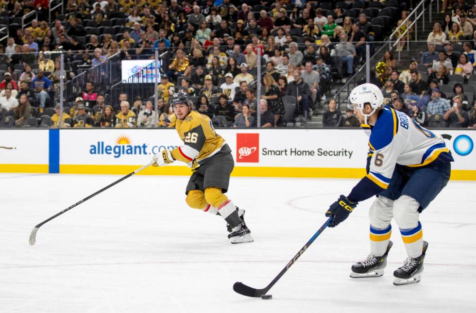 Golden Knights right wing Alexander Holtz (26) watches St. Louis Blues defenseman Philip Brober ...