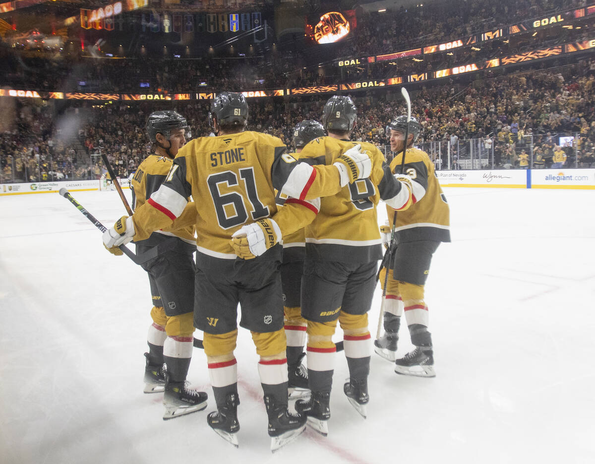 Golden Knights players celebrate a goal during the NHL hockey game against the St. Louis Blues ...