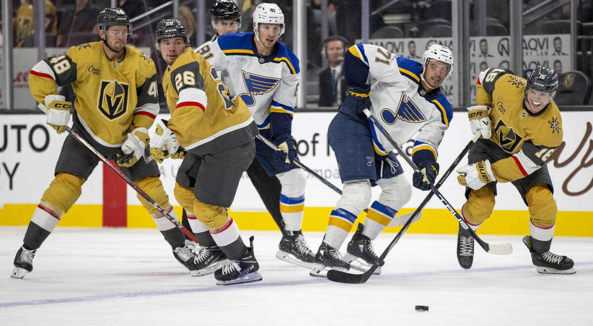 Golden Knights and St. Louis Blues players compete for the puck during the NHL hockey game at T ...