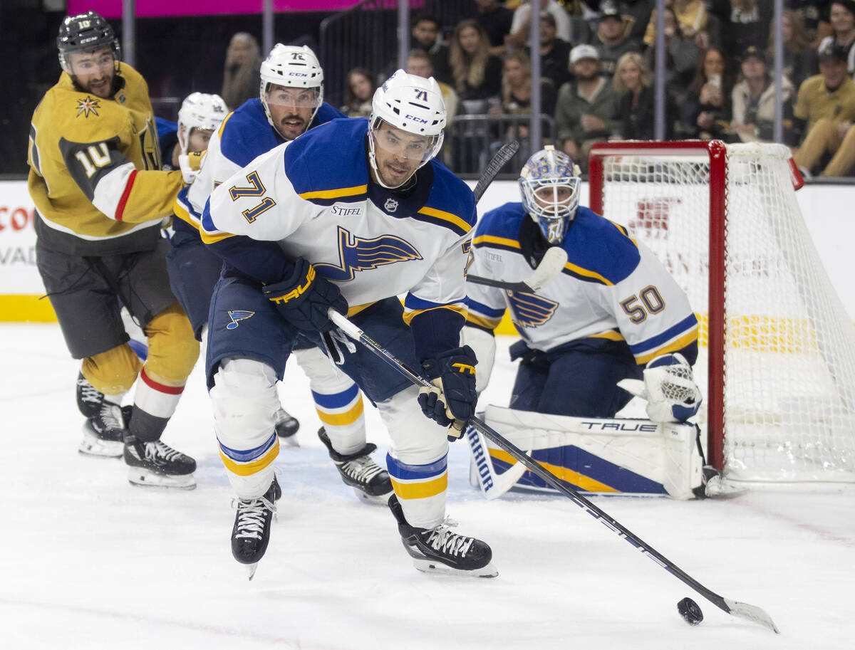 St. Louis Blues right wing Mathieu Joseph (71) takes the puck away from the net during the NHL ...