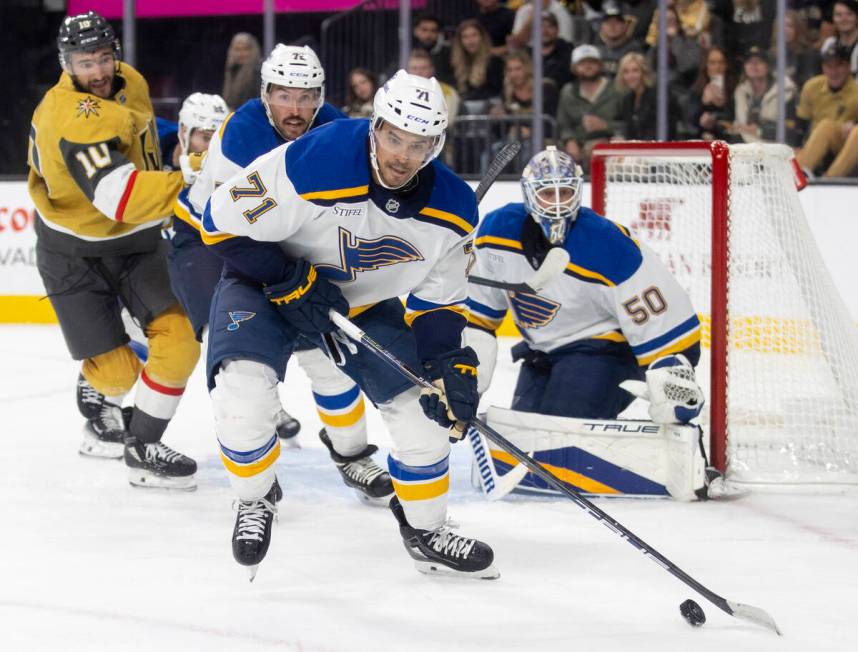 St. Louis Blues right wing Mathieu Joseph (71) takes the puck away from the net during the NHL ...