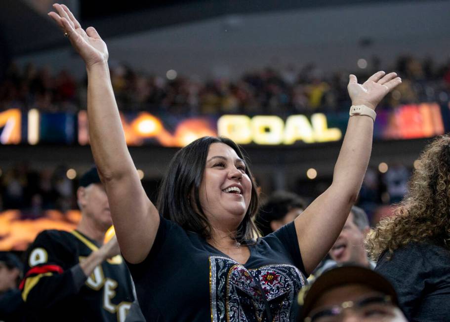 Golden Knights fans cheer after a goal is scored during the NHL hockey game against the St. Lou ...