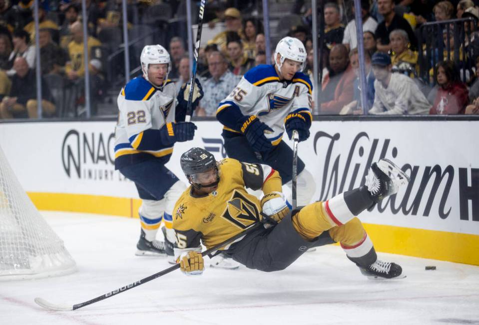 Golden Knights right wing Keegan Kolesar (55) is pushed off-balance during the NHL hockey game ...