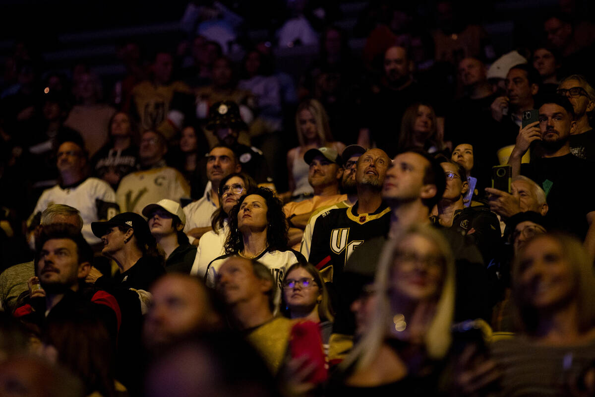 Golden Knights fans watch the introduction video before the NHL hockey game against the St. Lou ...