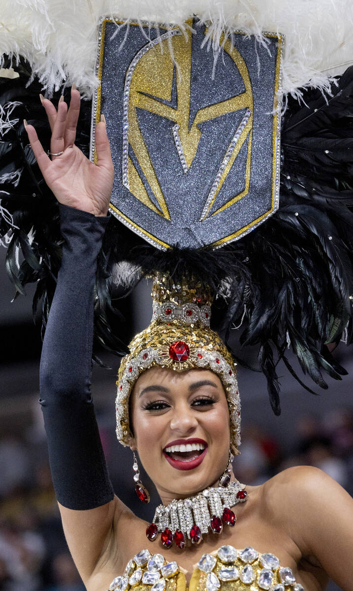 A Golden Knights showgirl dances before the NHL hockey game against the St. Louis Blues at T-Mo ...