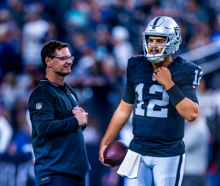 Raiders quarterback Aidan O'Connell (12) looks to teammates as they face the Dallas Cowboys for ...