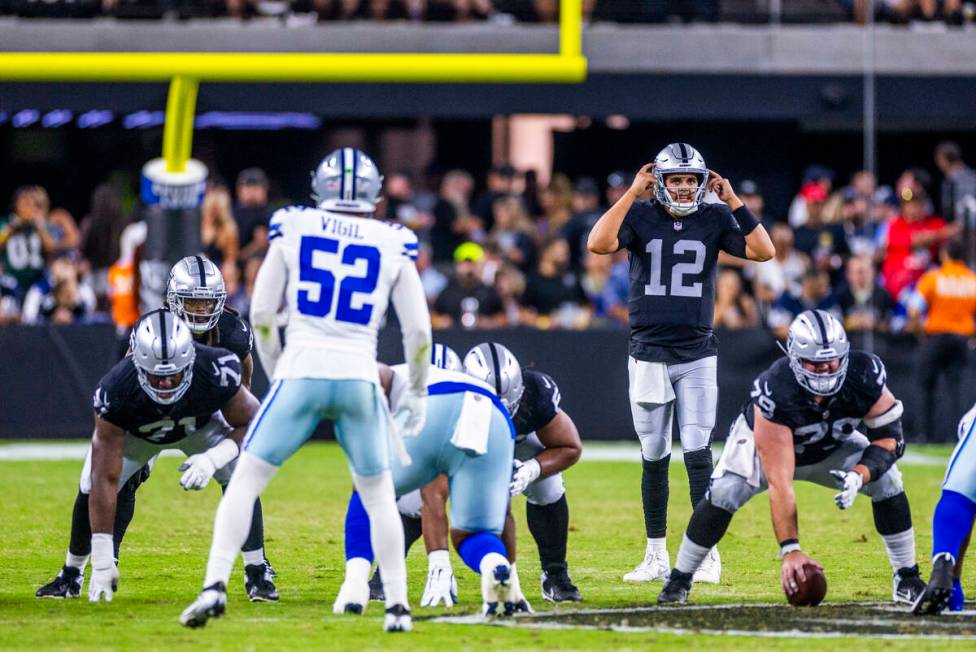 Raiders quarterback Aidan O'Connell (12) makes a call against the Dallas Cowboys during the sec ...