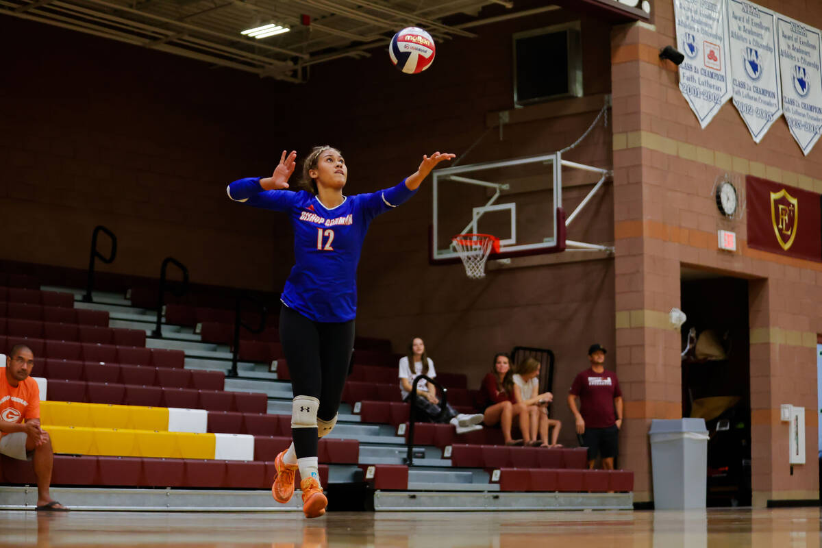 Bishop Gorman outside hitter Brooklynn Williams (12) serves the ball during a volleyball game ...