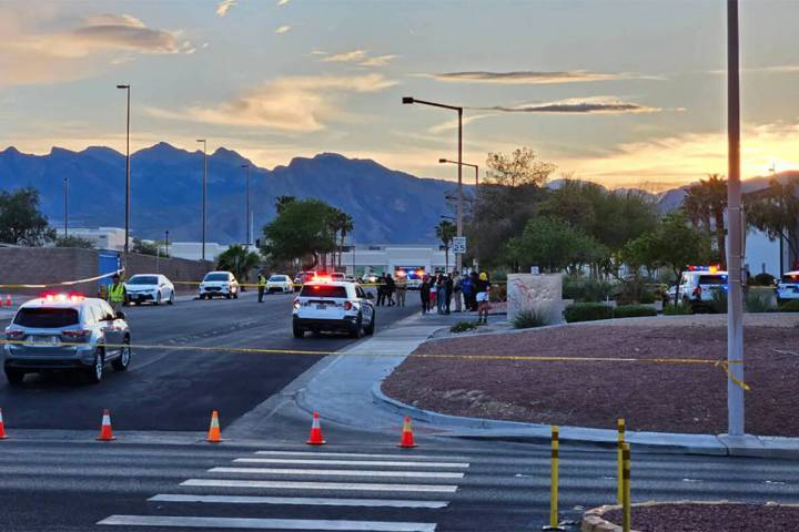 Metro police at the scene of a triple shooting in the 7300 block of Prairie Falcon Road on Satu ...