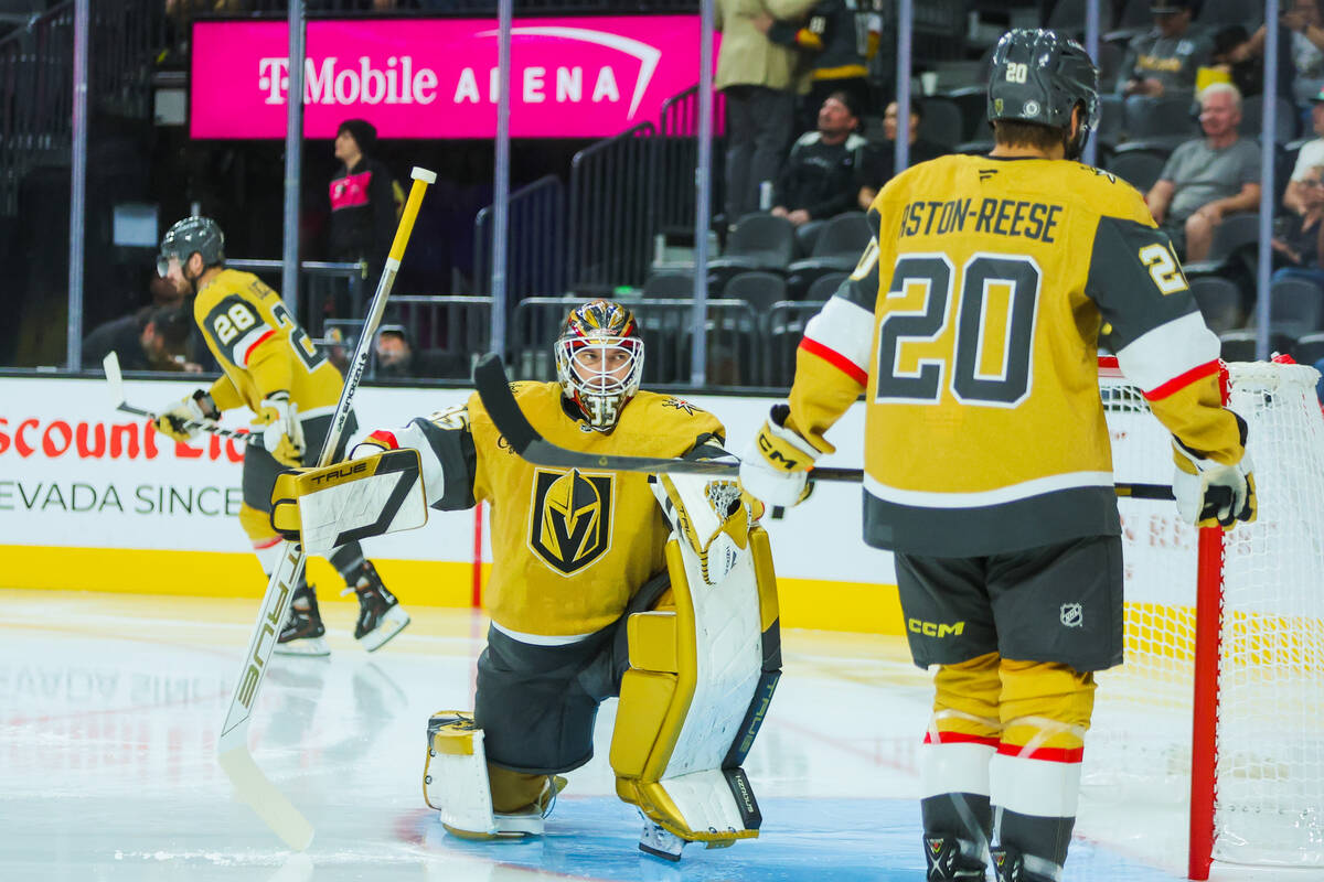 Golden Knights goalie Ilya Samsonov (35) is surrounded by teammates during warmups right before ...