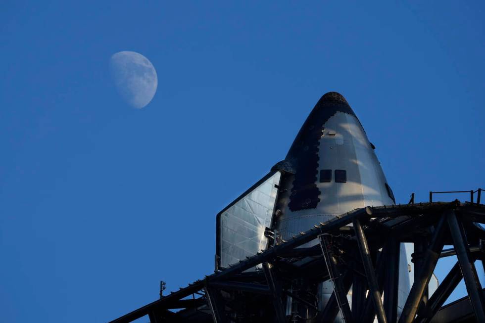 The moon rises over SpaceX's mega rocket Starship as it is prepares for a test launch Saturday, ...