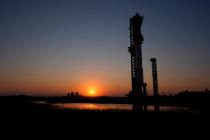 The sun sets behind SpaceX's mega rocket Starship, Saturday, Oct. 12, 2024, in Boca Chica, Texa ...