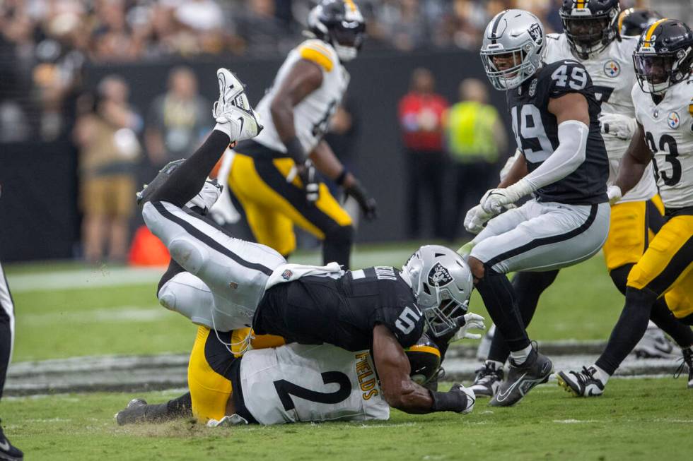 Raiders linebacker Divine Deablo (5) sacks Pittsburgh Steelers quarterback Justin Fields (2) du ...