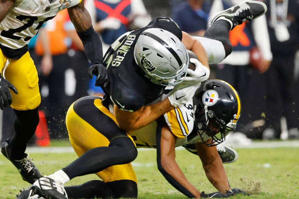 Raiders tight end Brock Bowers (89) is tackled by Pittsburgh Steelers safety Minkah Fitzpatrick ...