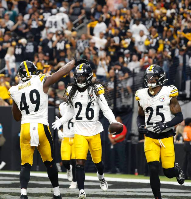 Pittsburgh Steelers cornerback Donte Jackson (26) celebrates with his teammates after intercept ...