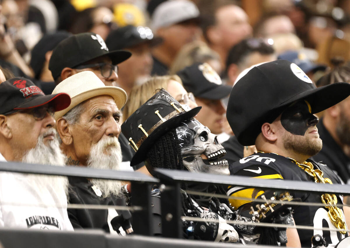 Raiders fans watch an NFL game against Pittsburgh at Allegiant Stadium, on Sunday, Oct. 13, 202 ...