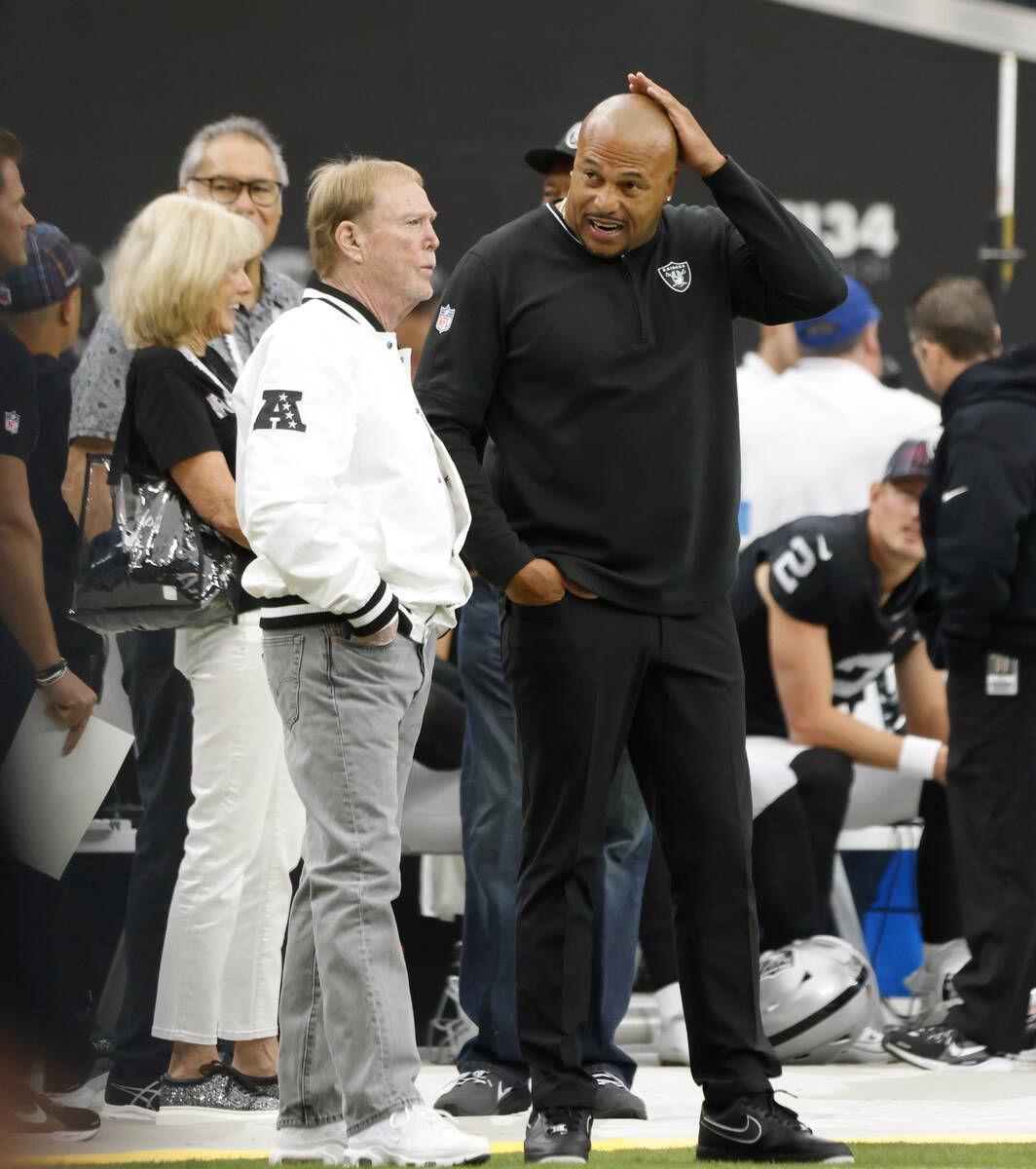 Raiders owner Mark Davis and head coach Antonio Pierce chat before an NFL game against Pittsbur ...