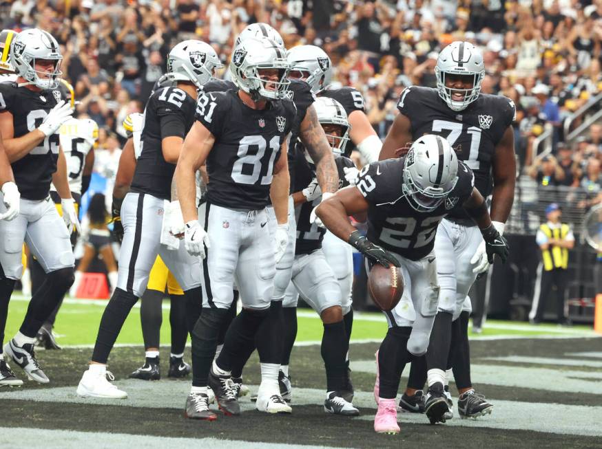 Raiders running back Alexander Mattison (22) celebrates his touchdown during the first half of ...