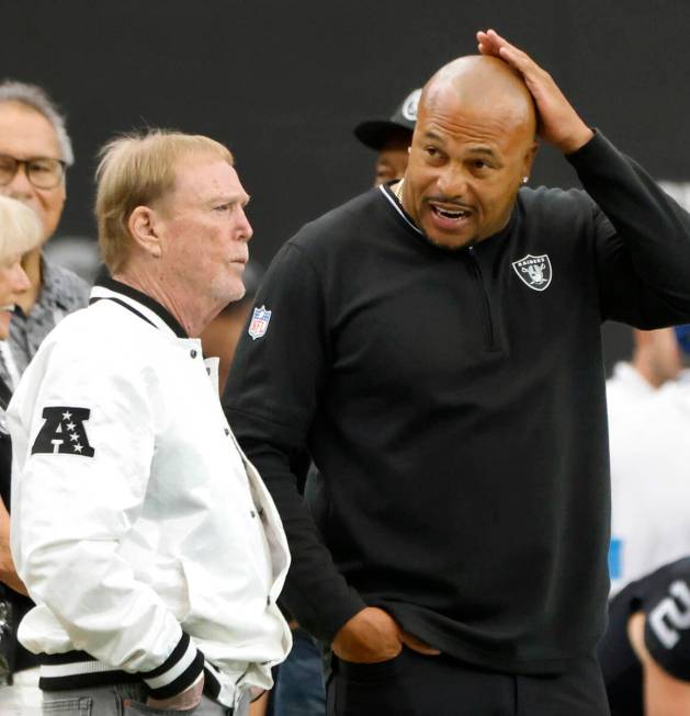 Raiders owner Mark Davis and head coach Antonio Pierce chat before an NFL game against Pittsbur ...