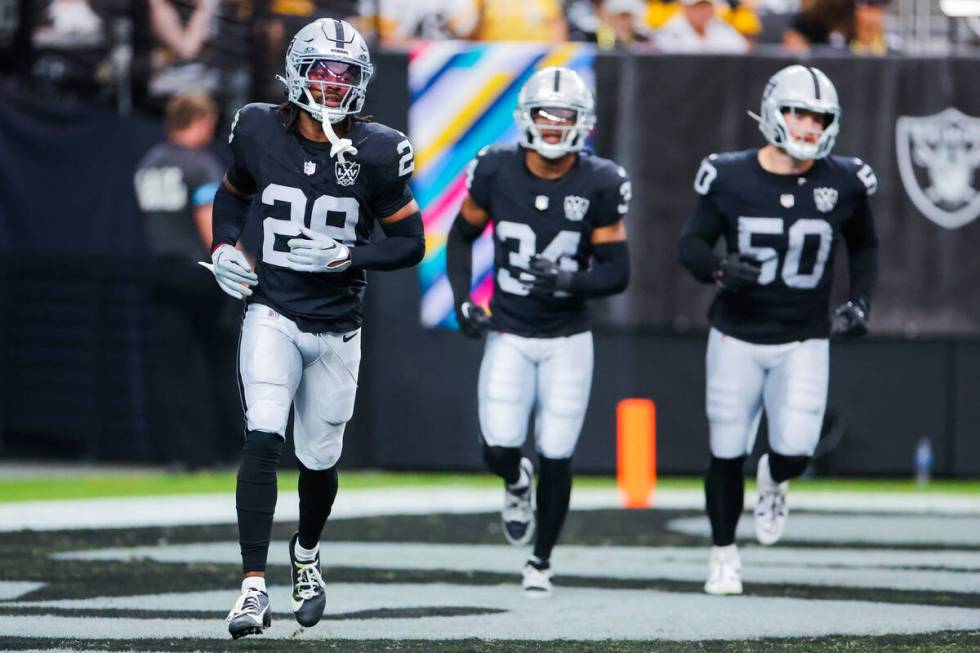 Raiders safety Chris Smith II (29) runs back to the sidelines during the second half of an NFL ...