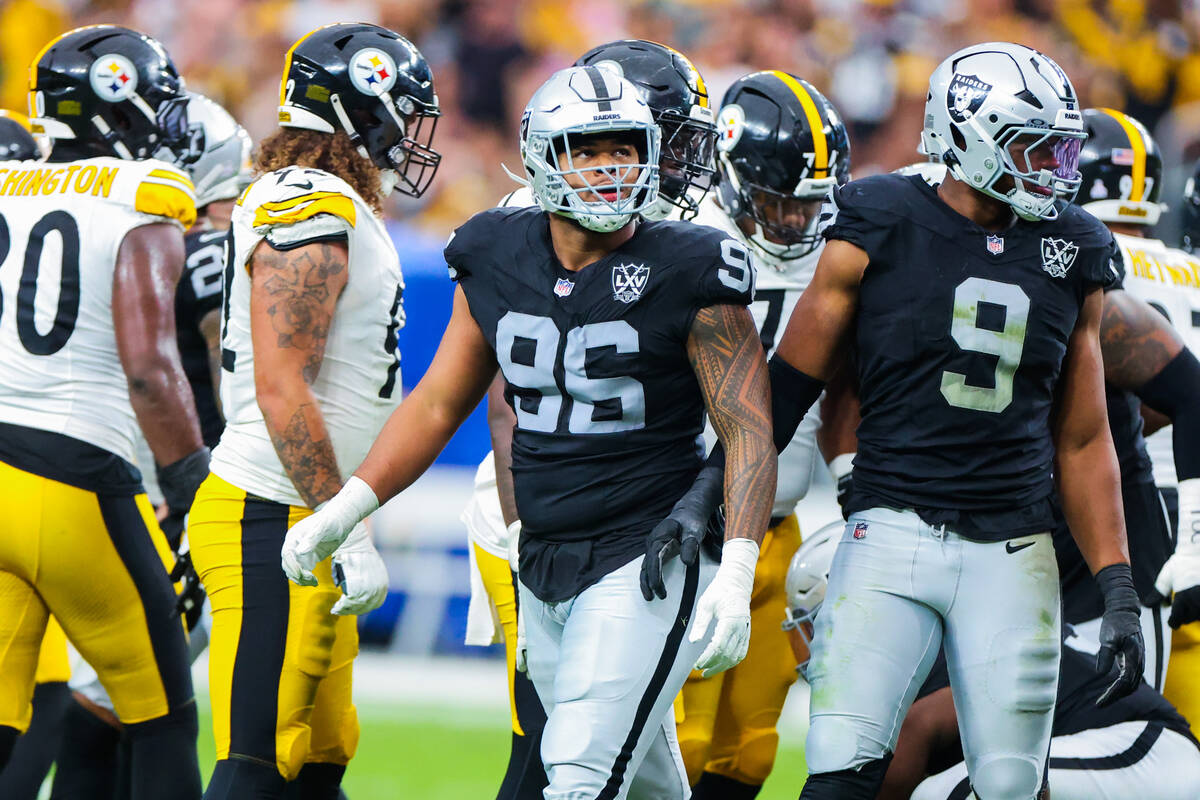 Raiders defensive tackle Jonah Laulu (96) looks up after the Pittsburgh Steelers made a field g ...