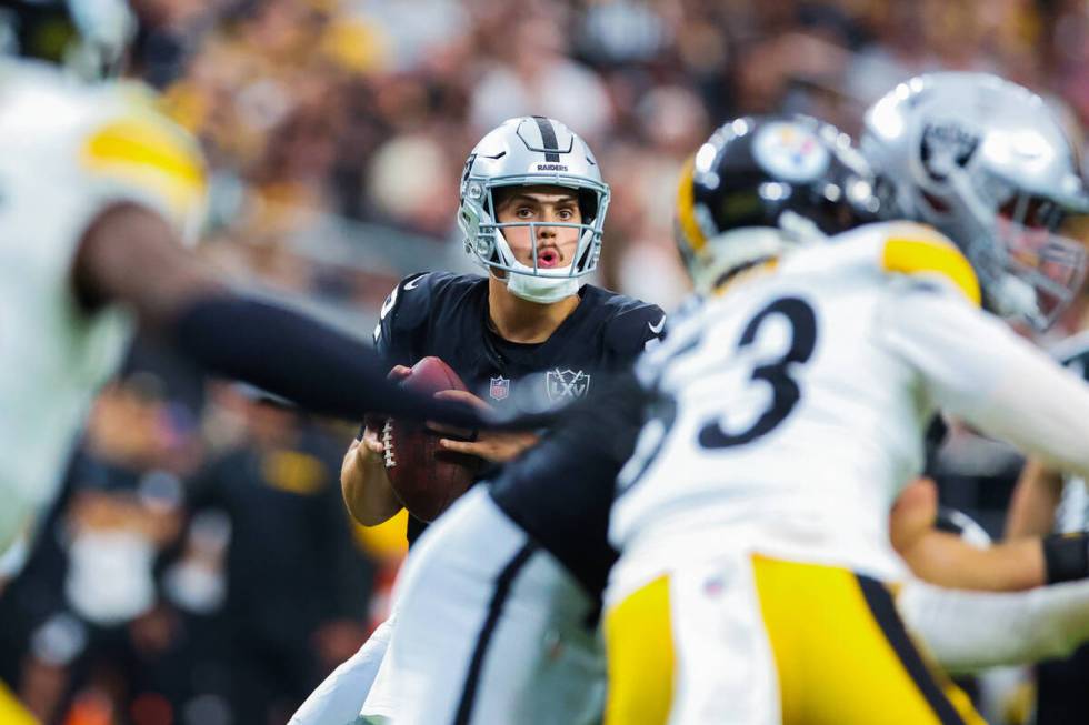 Raiders quarterback Aidan O'Connell (12) looks to throw the ball during the second half of an N ...