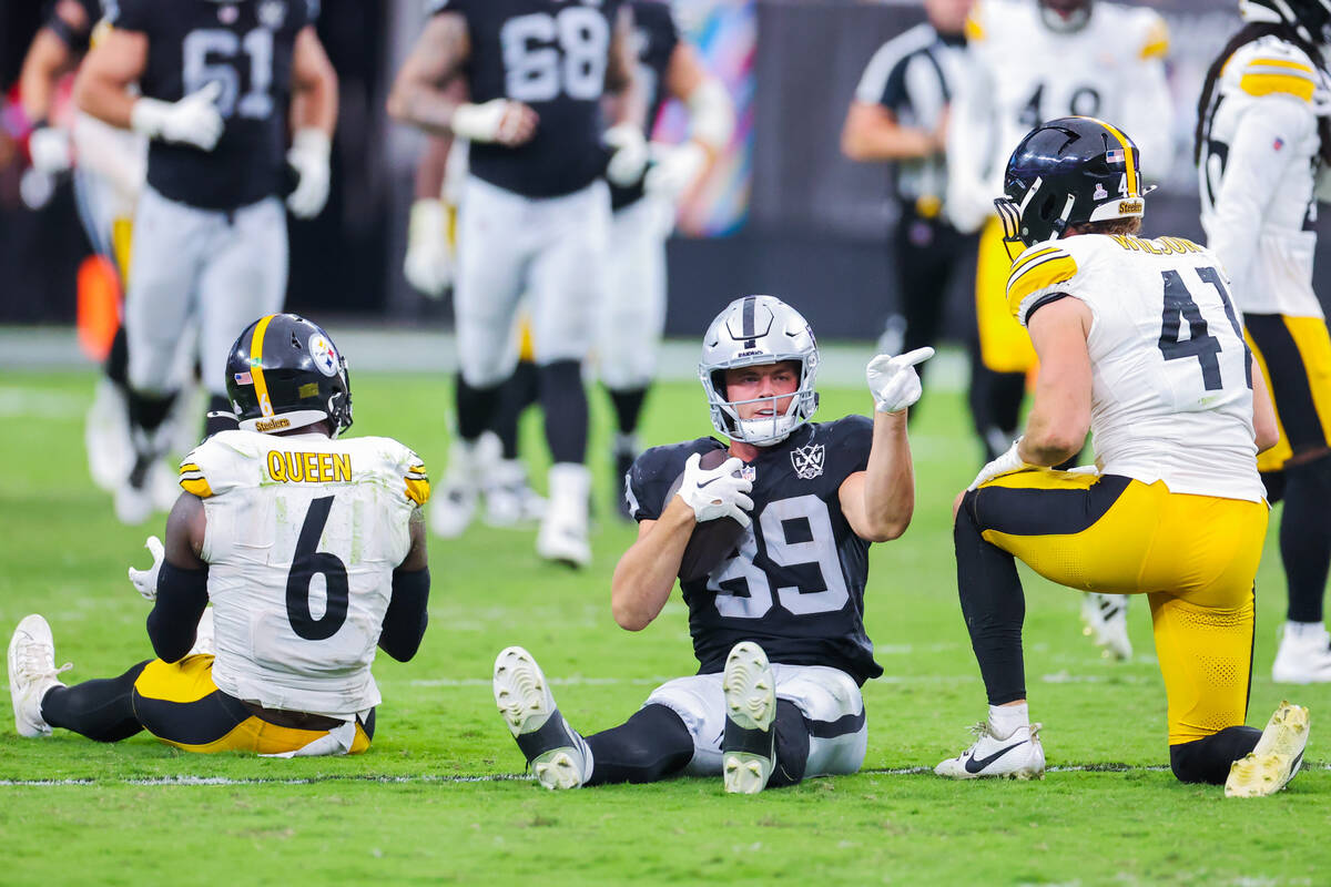 Raiders tight end Brock Bowers (89) points to the Raiders’ end zone during the second ha ...