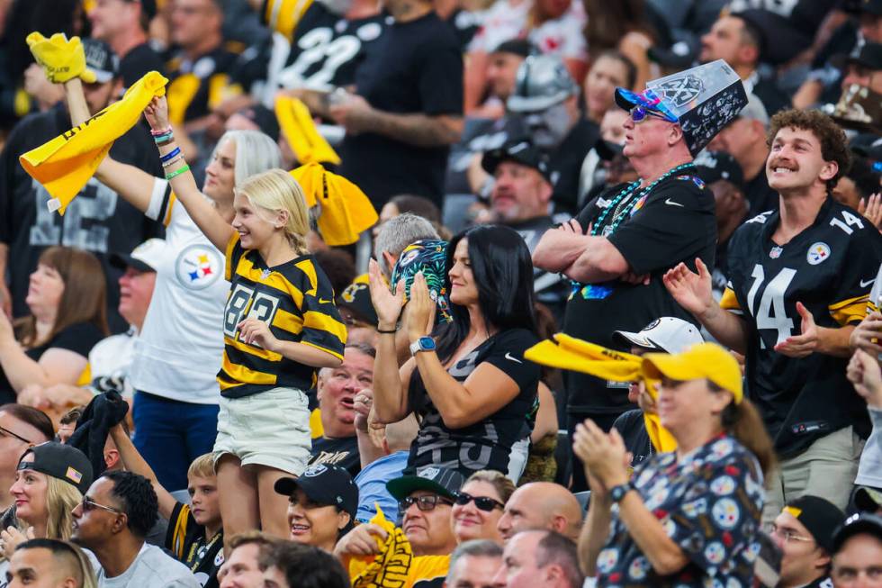 Pittsburgh Steelers fans cheer during the second half off an NFL football game between the Raid ...