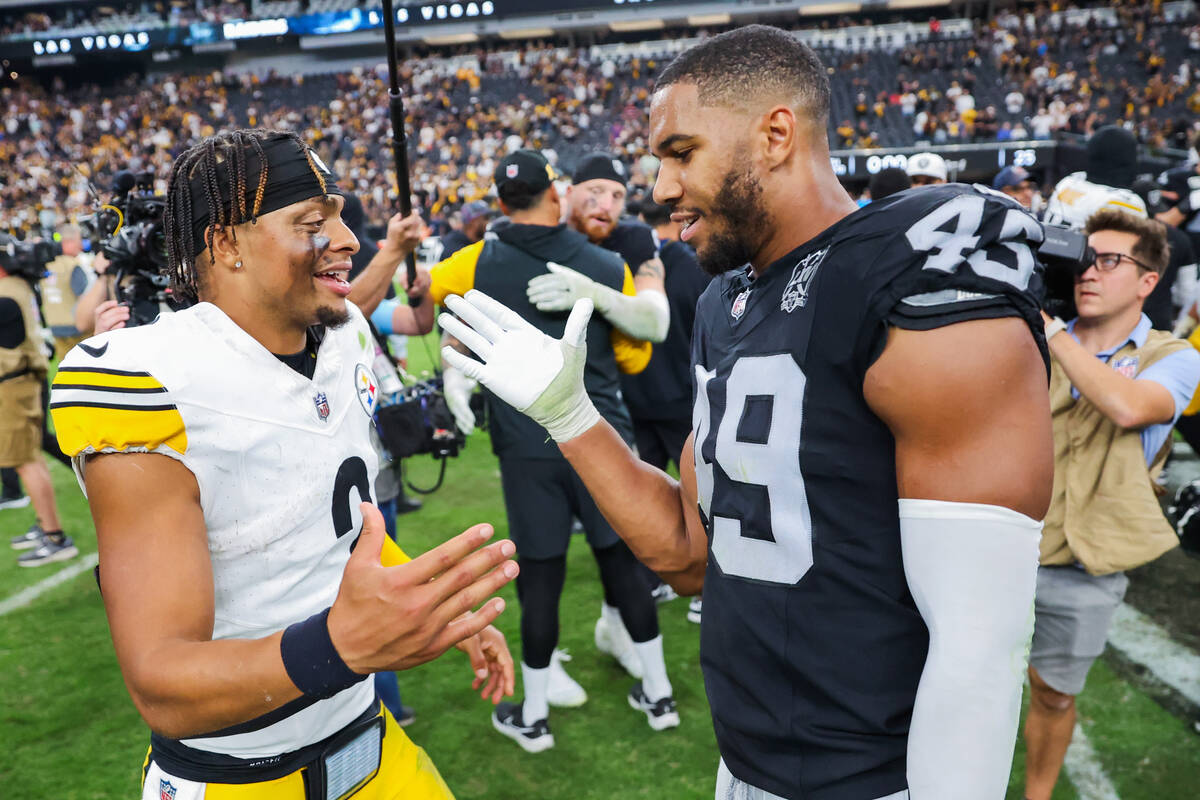 Raiders linebacker Tommy Eichenberg (45) daps up Pittsburgh Steelers quarterback Justin Fields ...