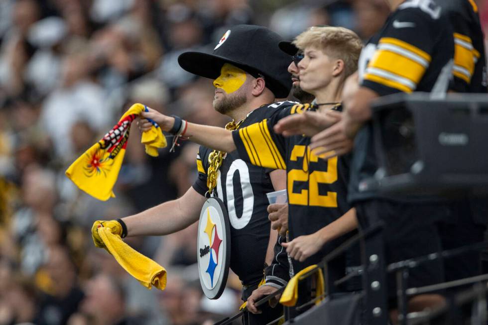 Pittsburgh Steelers fans waves their Terrible Towels during the first half of an NFL game again ...