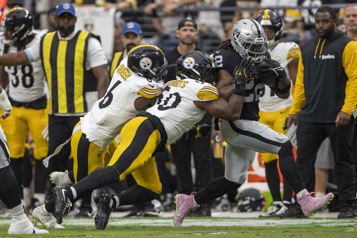 Raiders running back Alexander Mattison (22) is forced out of bounds by Pittsburgh Steelers lin ...