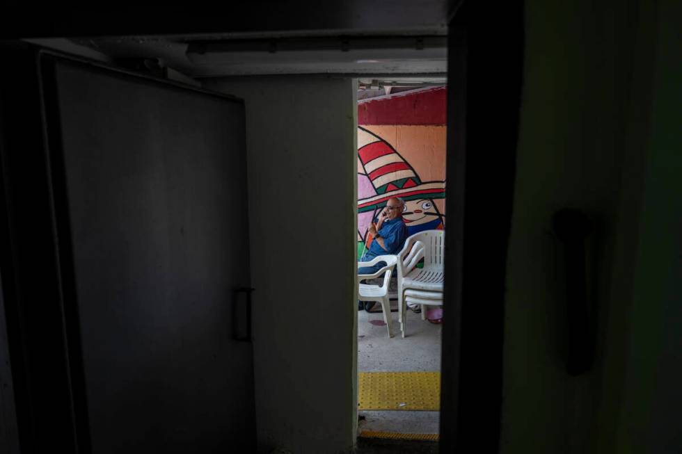 A man speaks on the phone in a public bomb shelter to stay safe from rockets fired from Lebanon ...