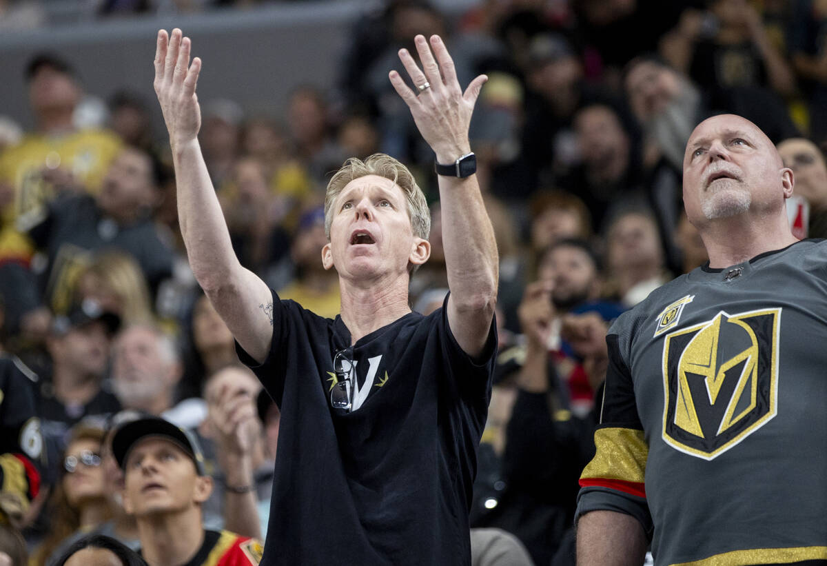 Golden Knights fans react as a goal is called off during the second period of the NHL hockey ga ...