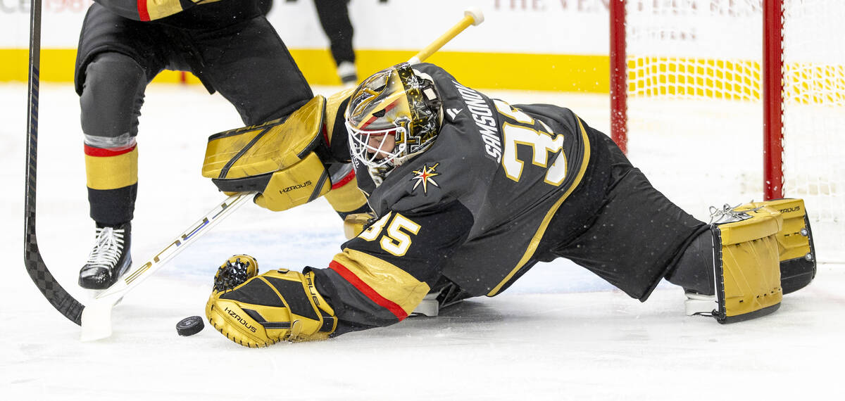 Golden Knights goaltender Ilya Samsonov (35) attempts to cover the puck during the second perio ...