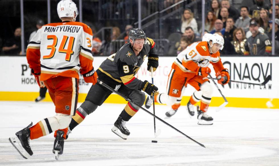 Golden Knights center Jack Eichel (9) moves the puck up the ice during the third period of the ...