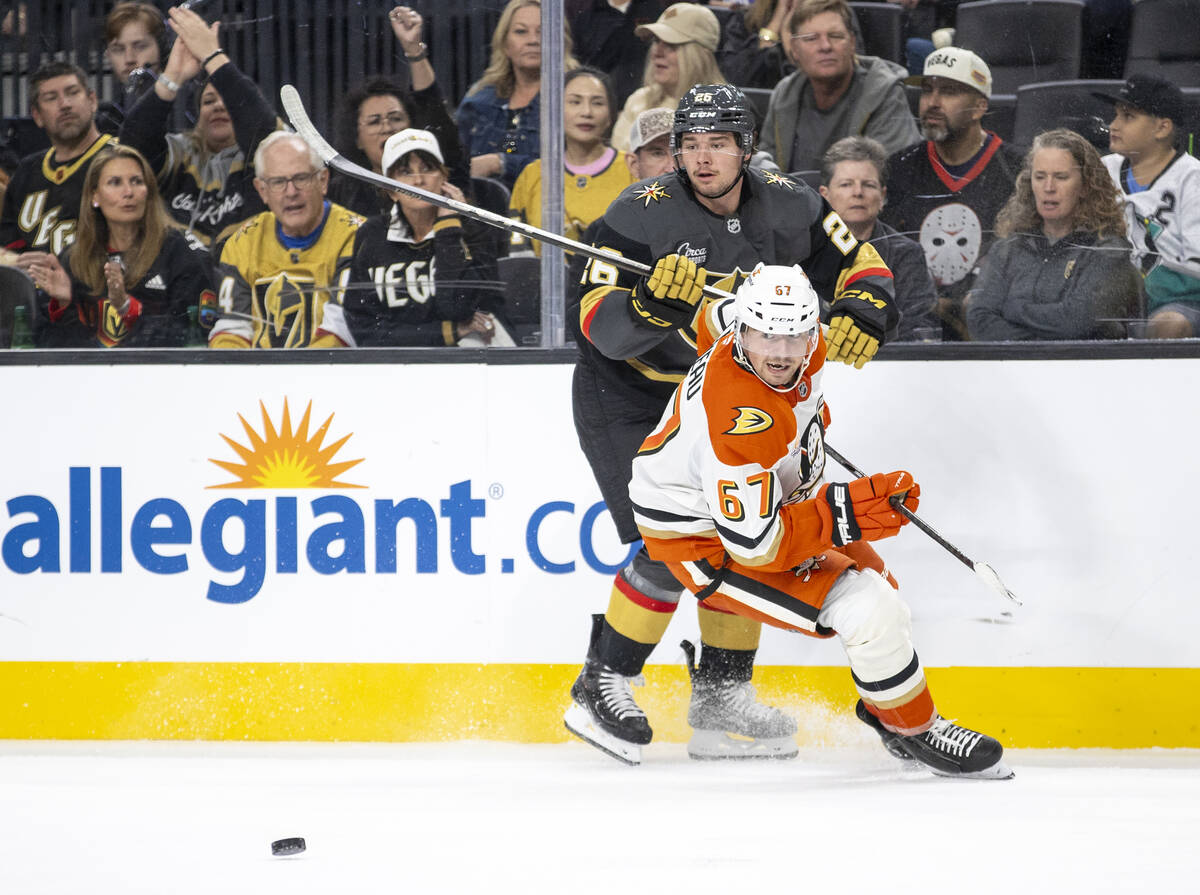 Golden Knights right wing Alexander Holtz (26) and Anaheim Ducks defenseman Tristan Luneau (67) ...