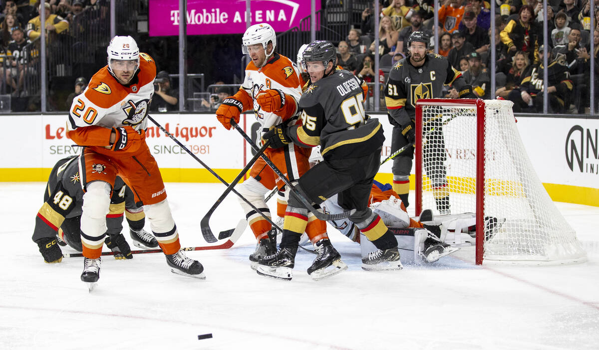 Golden Knights and Anaheim Ducks players look for the puck during the third period of the NHL h ...