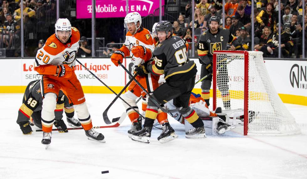 Golden Knights and Anaheim Ducks players look for the puck during the third period of the NHL h ...