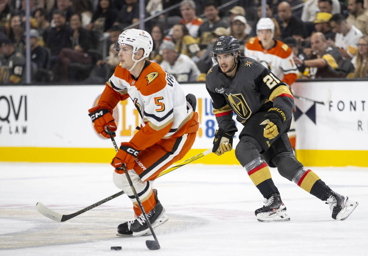 Golden Knights center Brett Howden (21) chases Anaheim Ducks defenseman Urho Vaakanainen (5) du ...