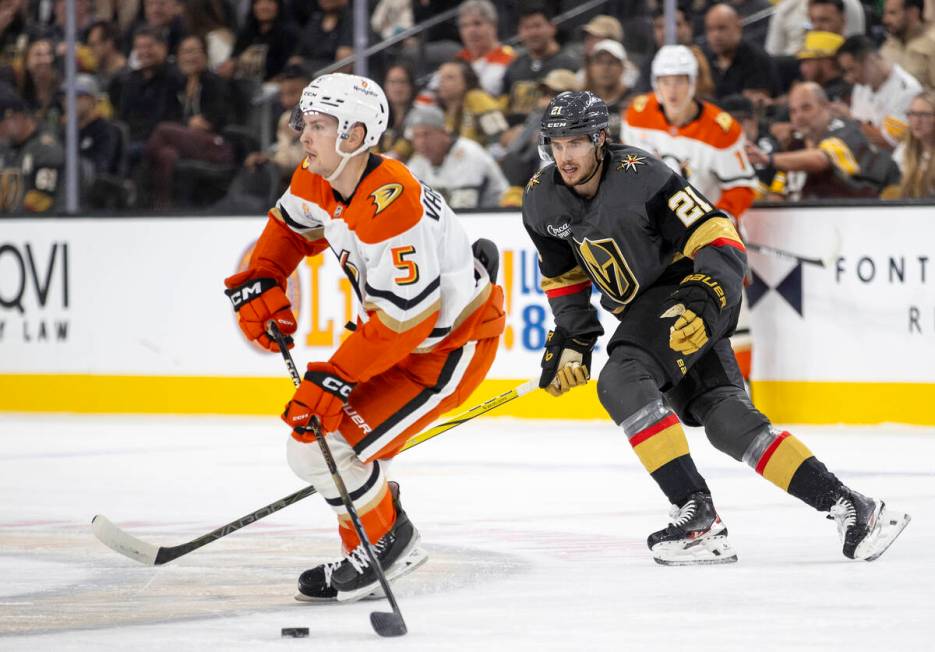 Golden Knights center Brett Howden (21) chases Anaheim Ducks defenseman Urho Vaakanainen (5) du ...