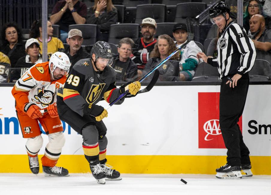 Golden Knights center Ivan Barbashev (49) and Anaheim Ducks left wing Alex Killorn (17) compete ...