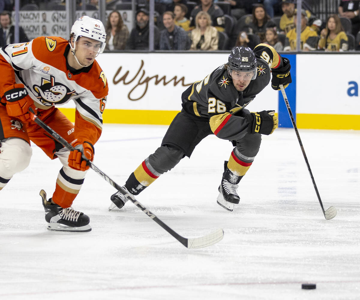 Golden Knights right wing Alexander Holtz (26) and Anaheim Ducks left wing Cutter Gauthier (61) ...